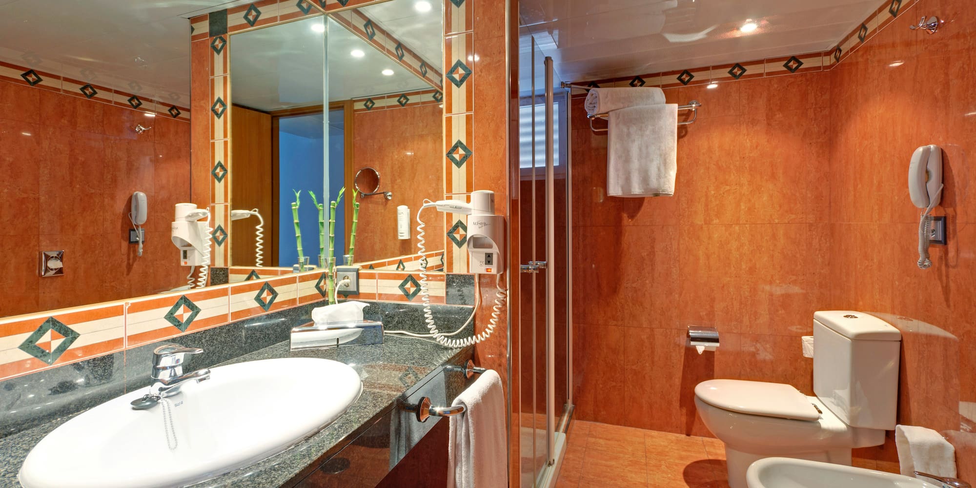 a bathroom with a mirror and sink