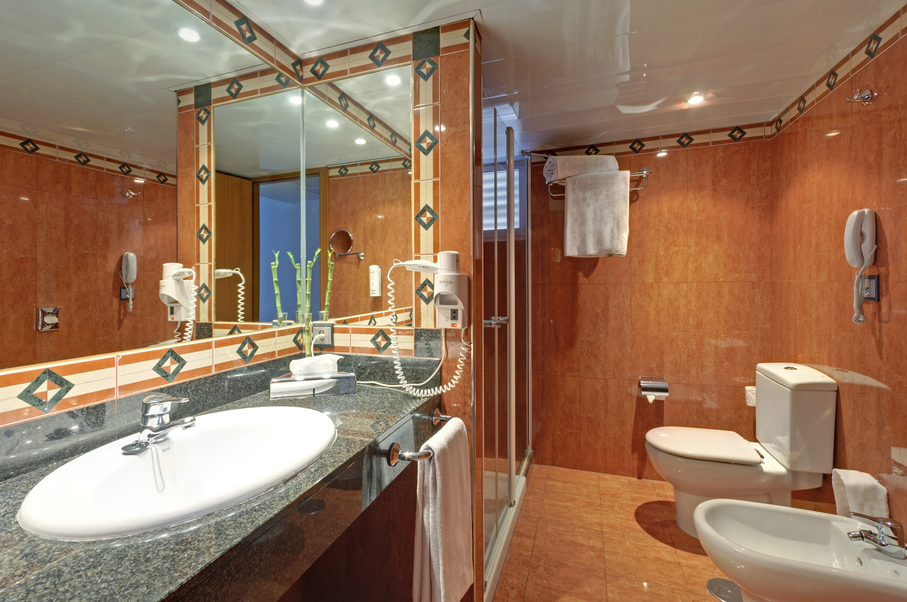 a bathroom with a mirror and sink