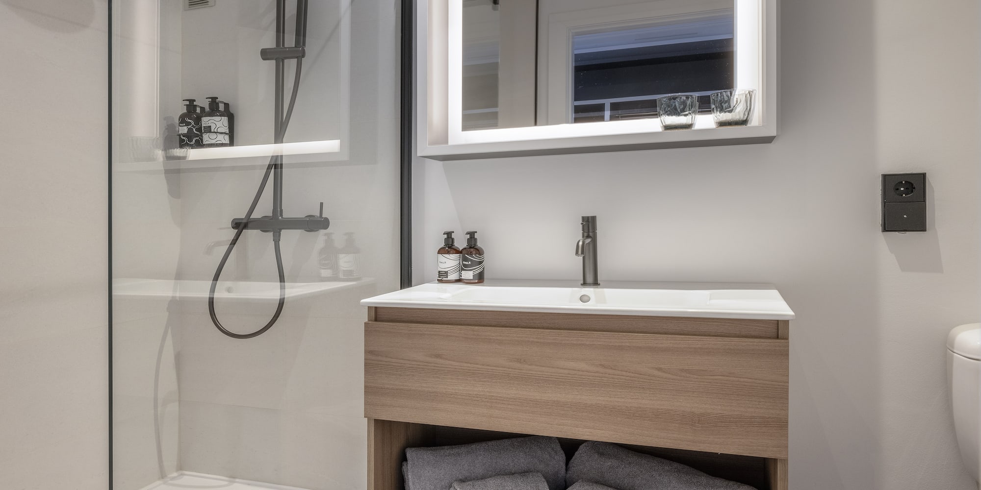 a bathroom with a mirror and a sink