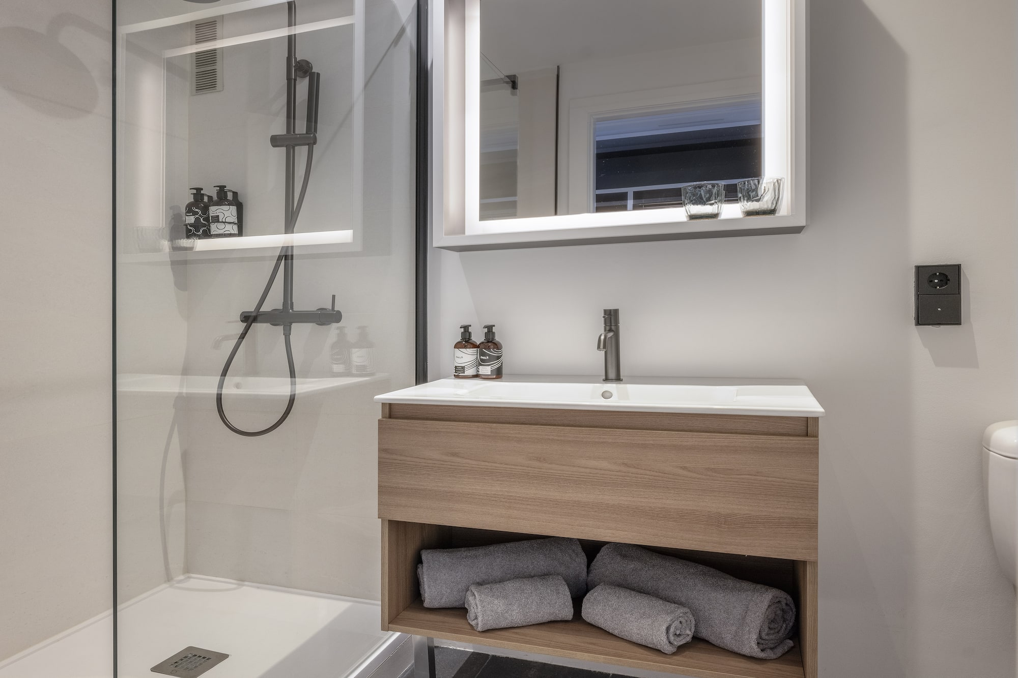 a bathroom with a mirror and a sink