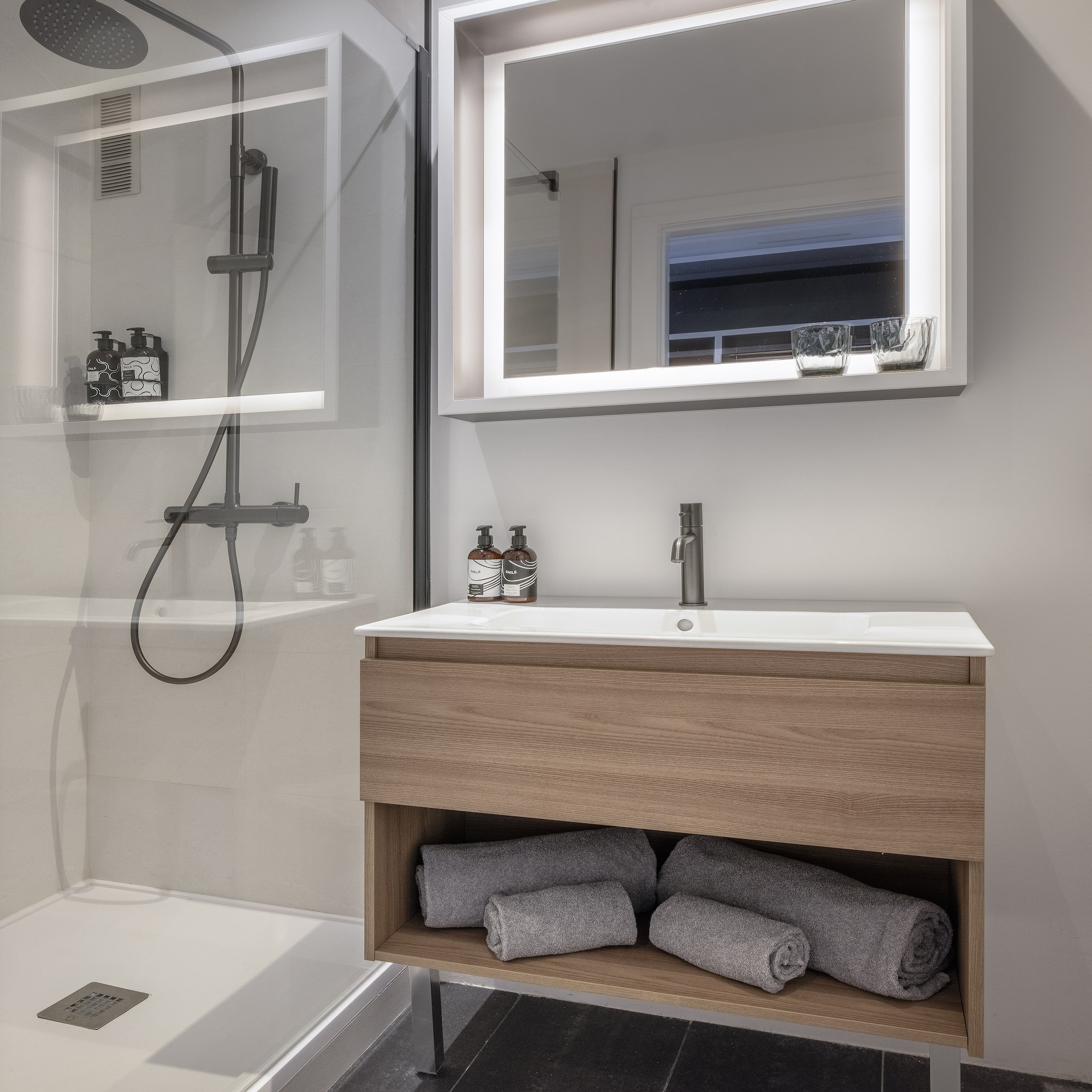a bathroom with a mirror and a sink
