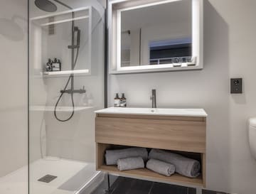 a bathroom with a mirror and a sink