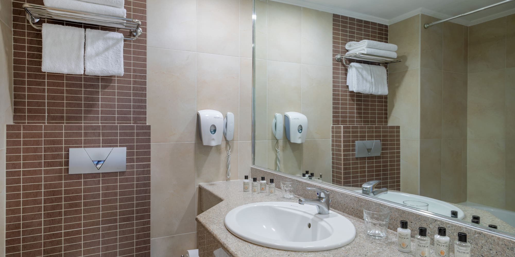 a bathroom with a sink and mirror