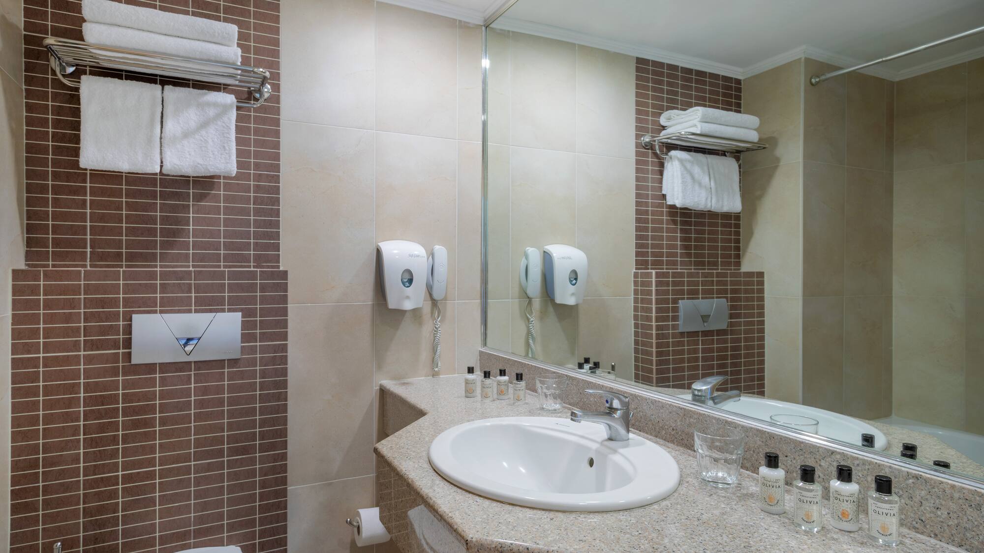 a bathroom with a sink and mirror