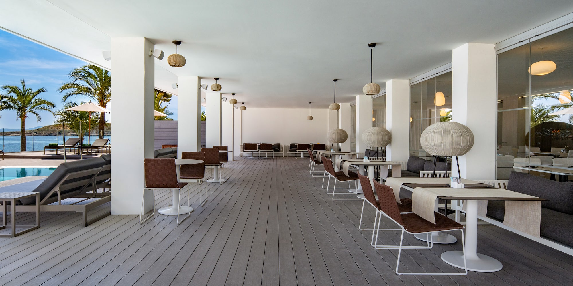 a patio with tables and chairs