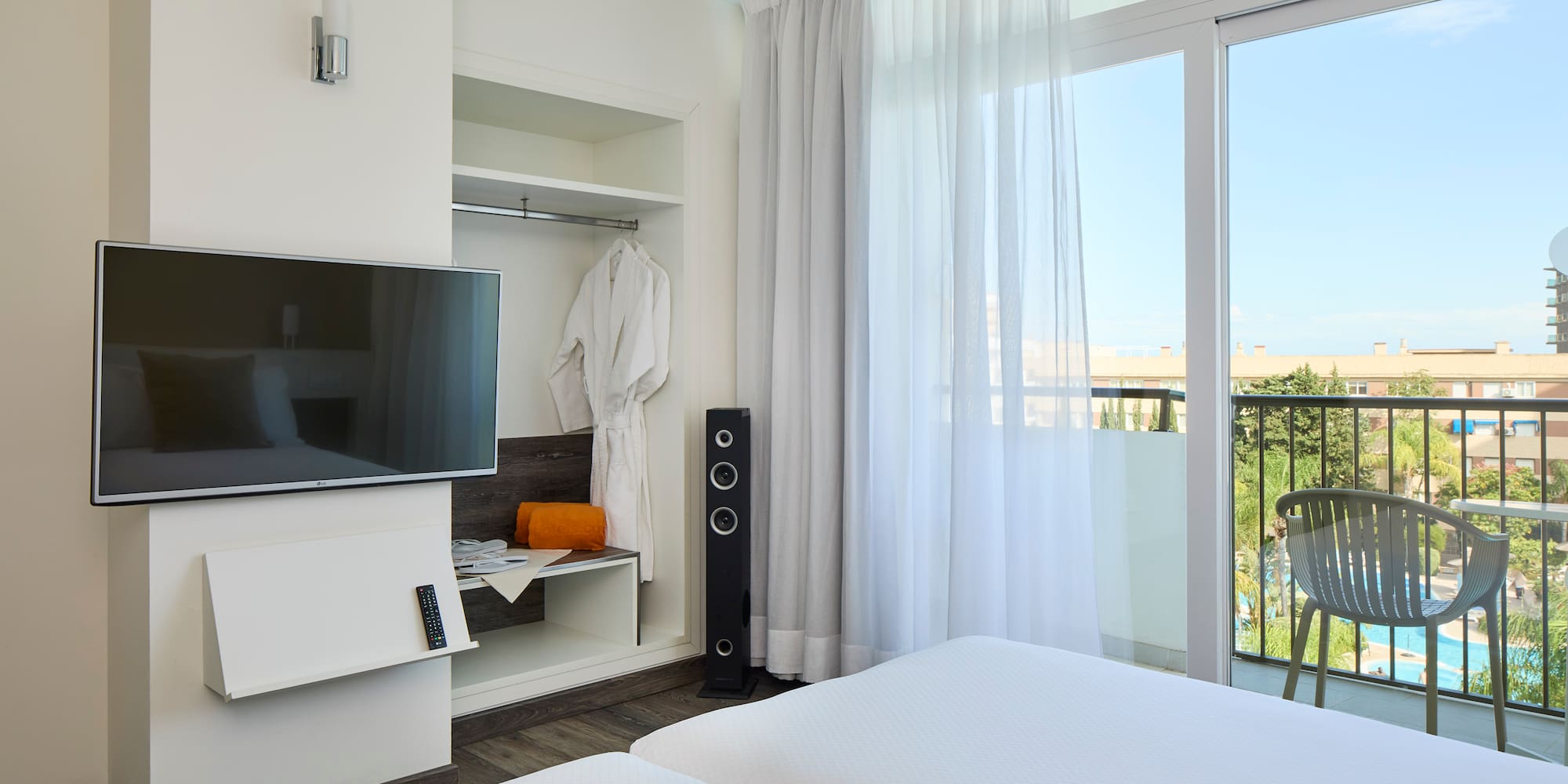 a room with a television and a balcony