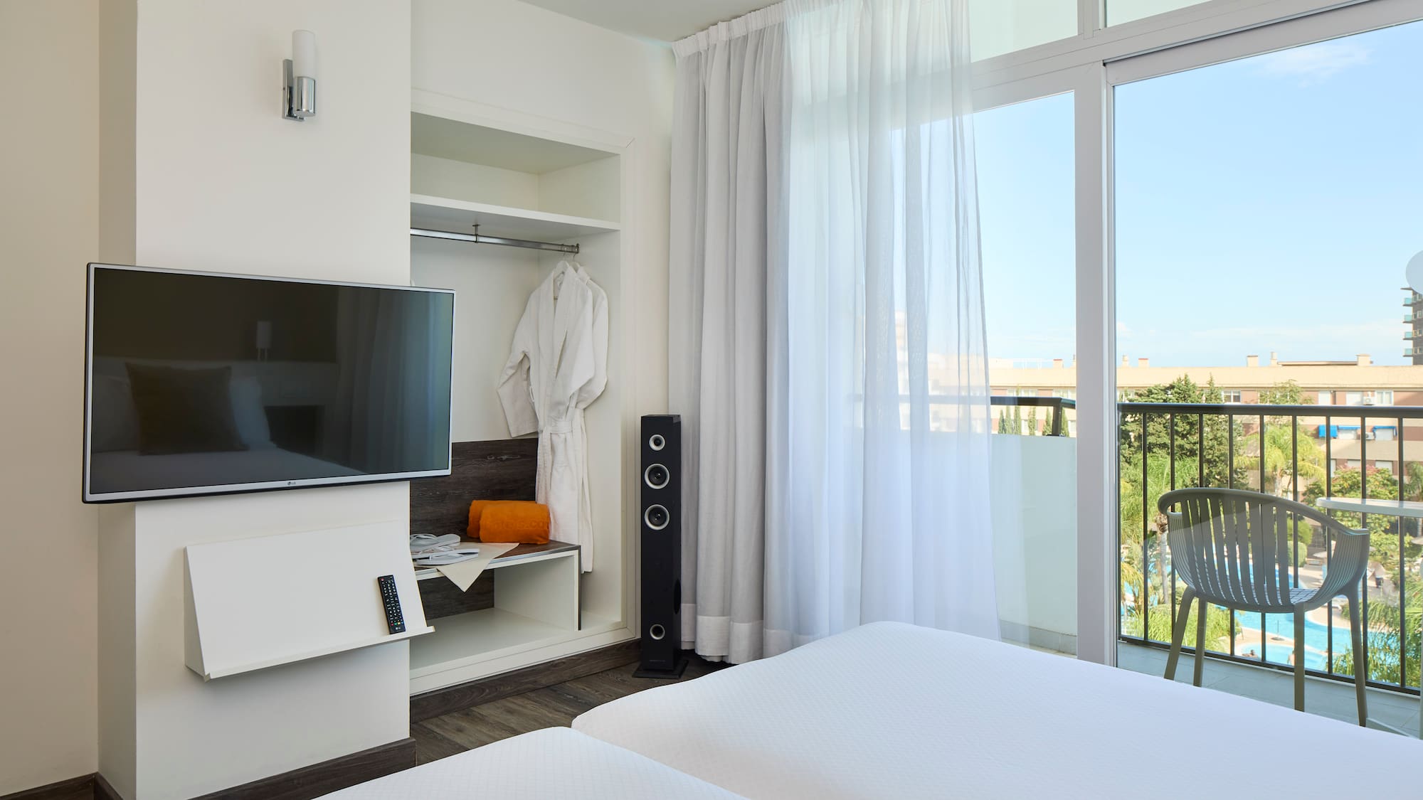 a room with a television and a balcony