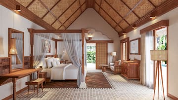a bedroom with a bed and a dresser