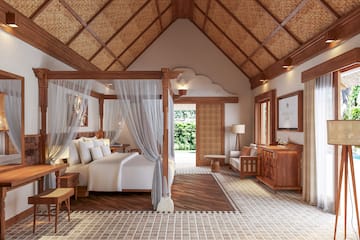 a bedroom with a bed and a dresser