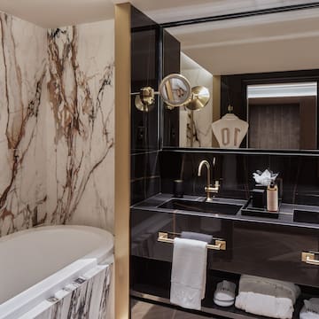 a bathroom with a tub and sink