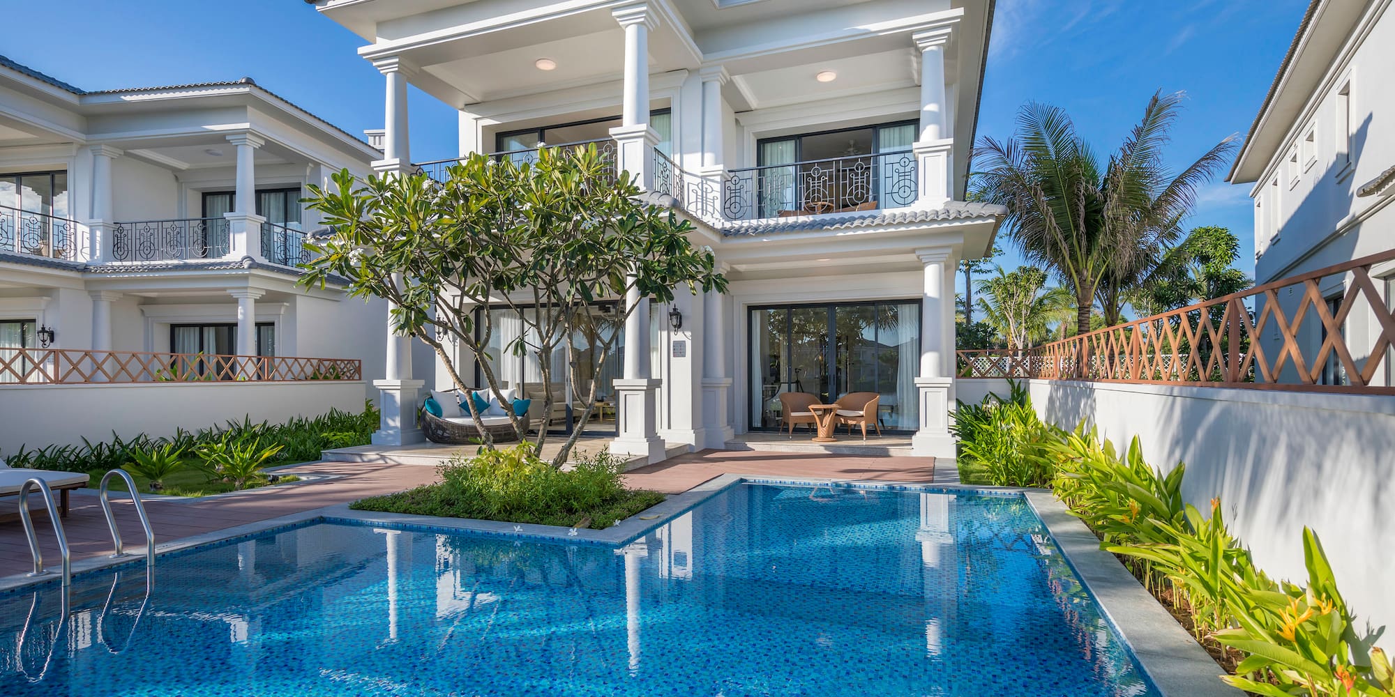a pool in front of a house