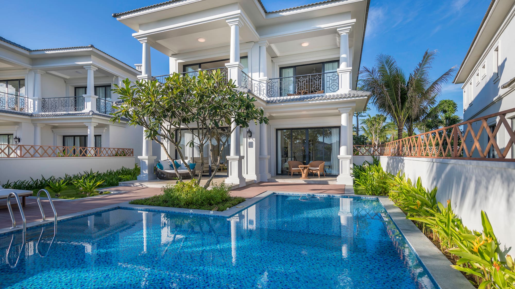 a pool in front of a house