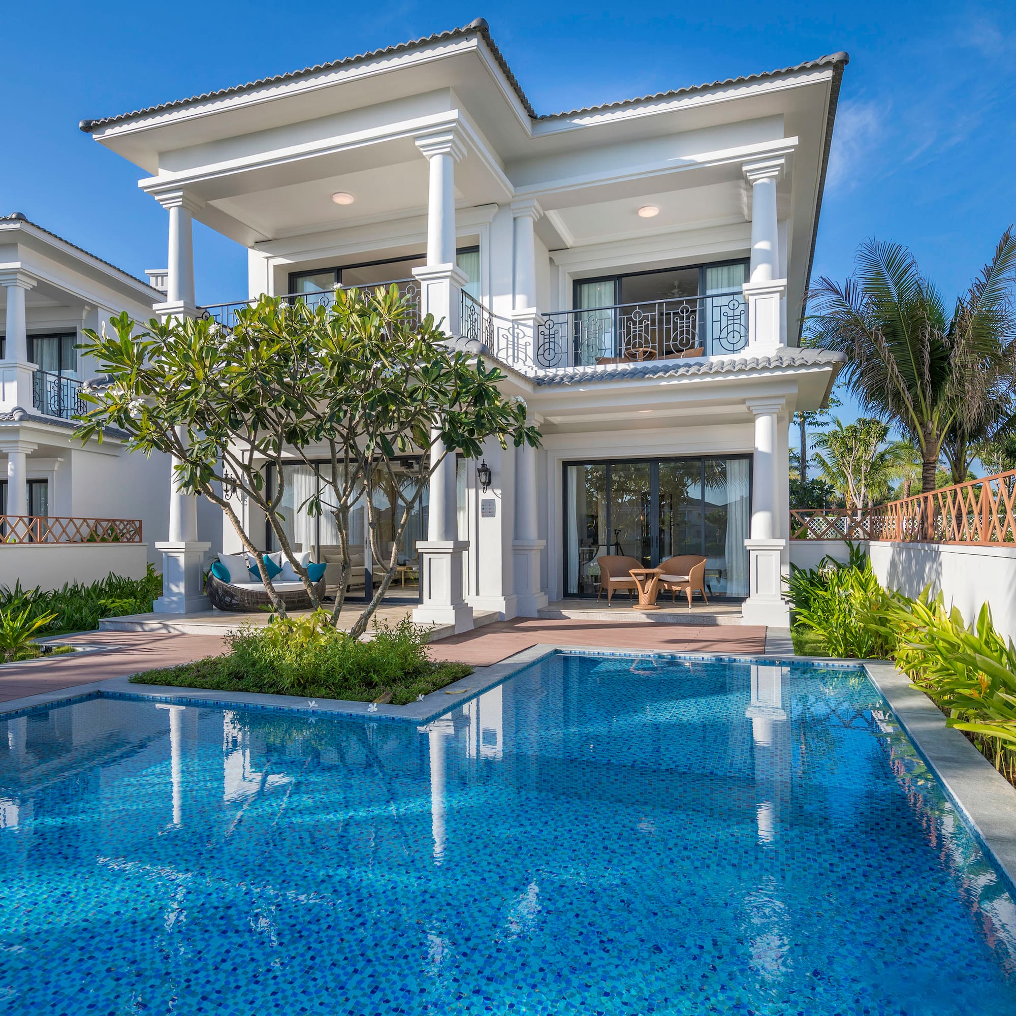 a pool in front of a house
