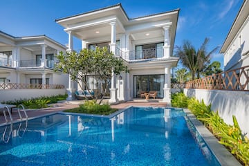 a pool in front of a house