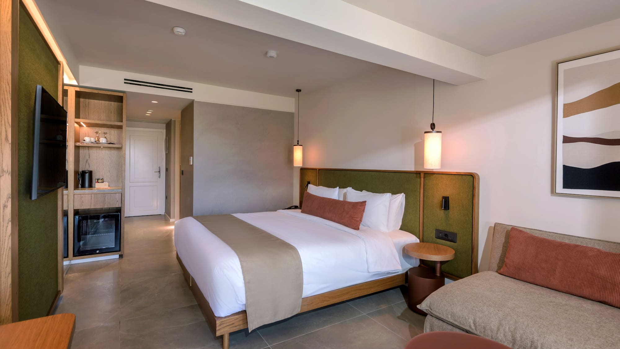 a bedroom with a bed and a television.