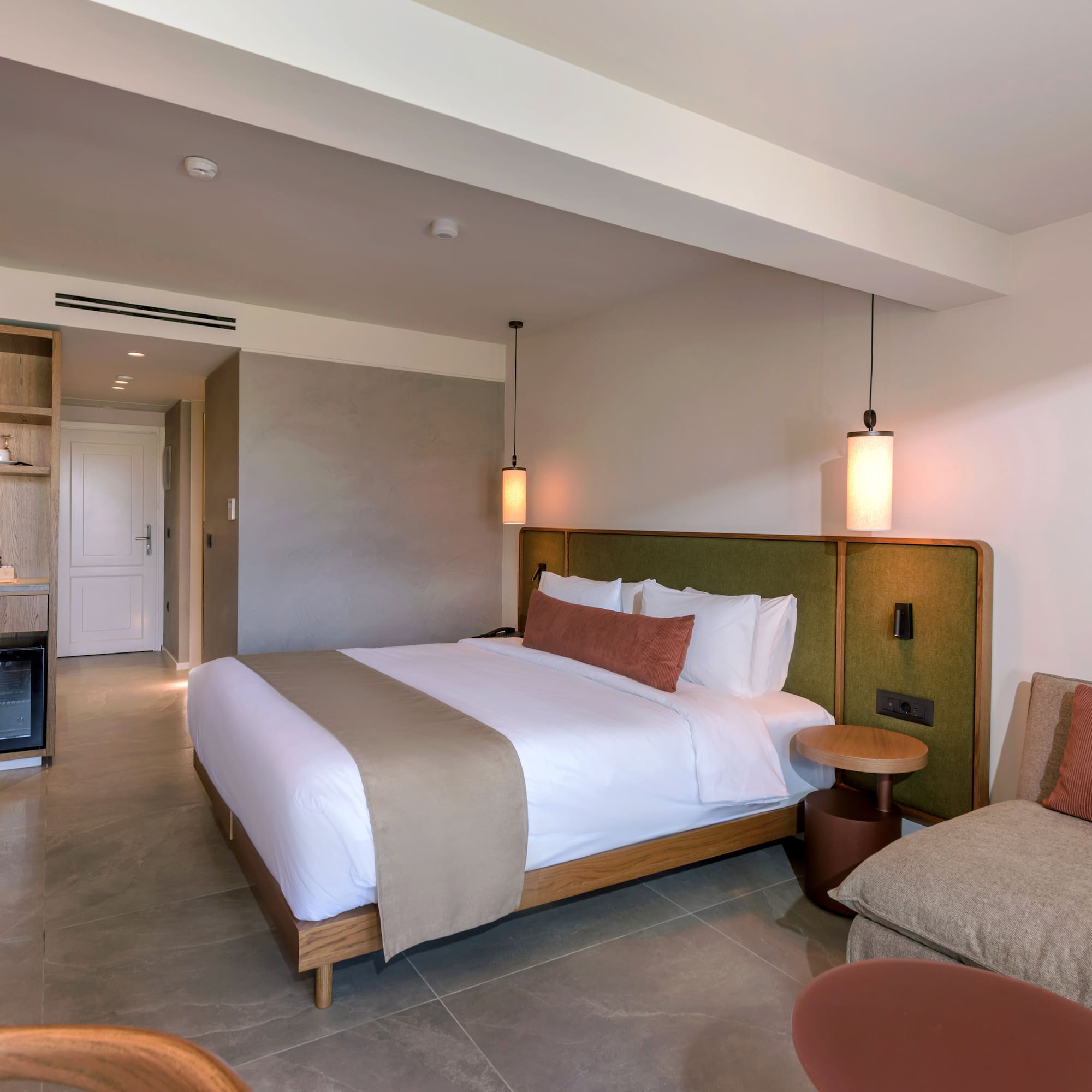 a bedroom with a bed and a television.