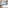 Luxury hotel suite with balcony, tropical resort view, and king bed.