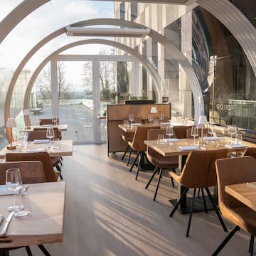 a restaurant with tables and chairs