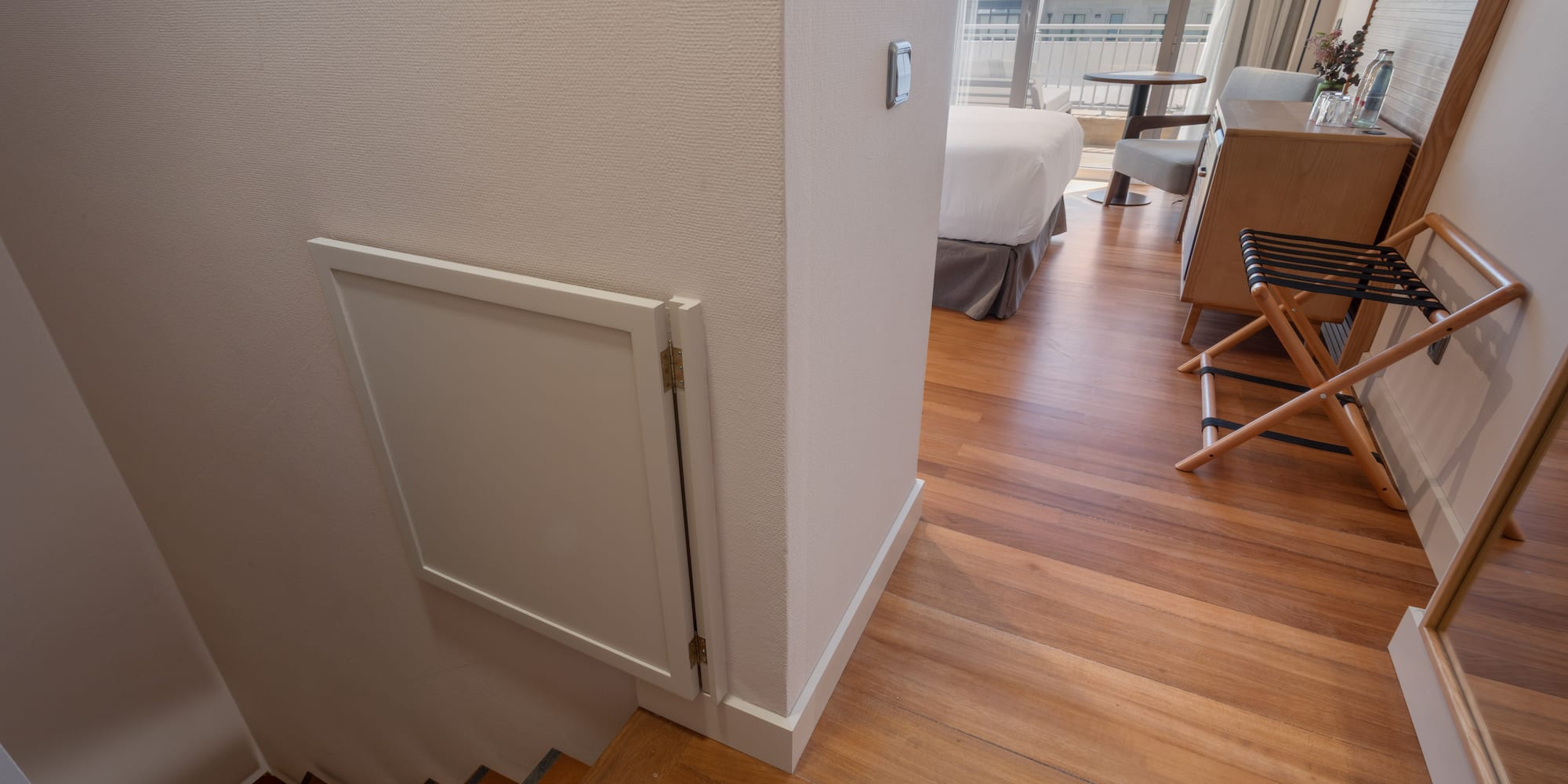 a room with a bed and stairs