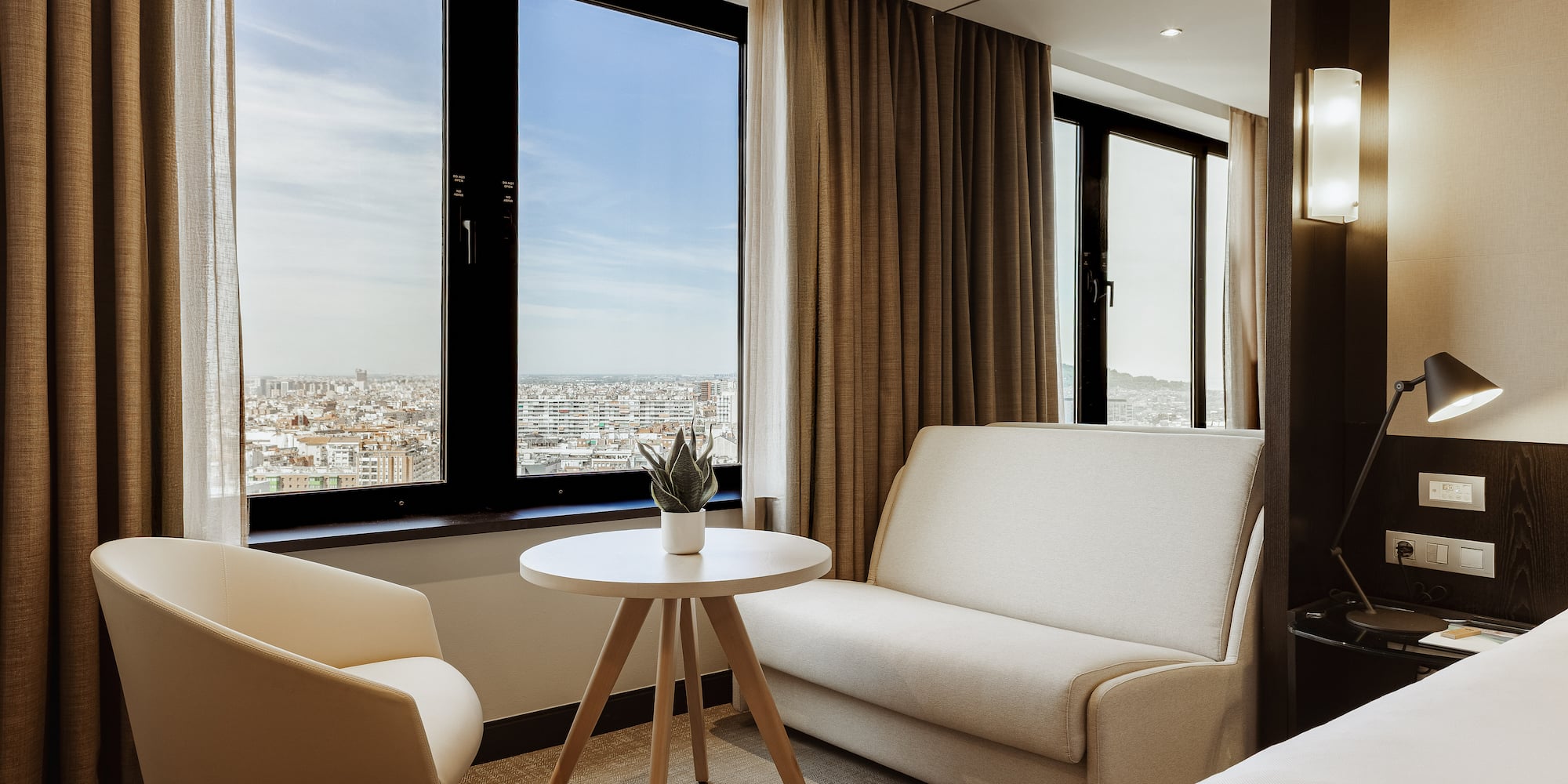 a room with two beds and a couch