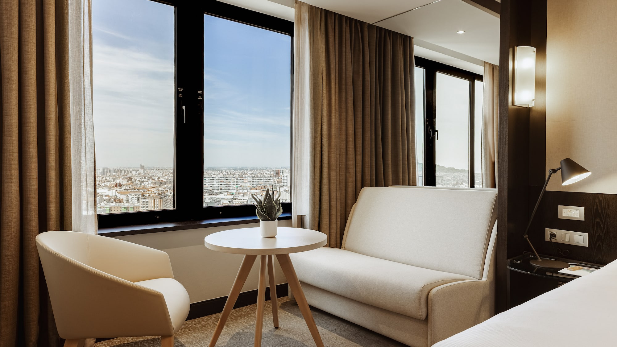 a room with two beds and a couch