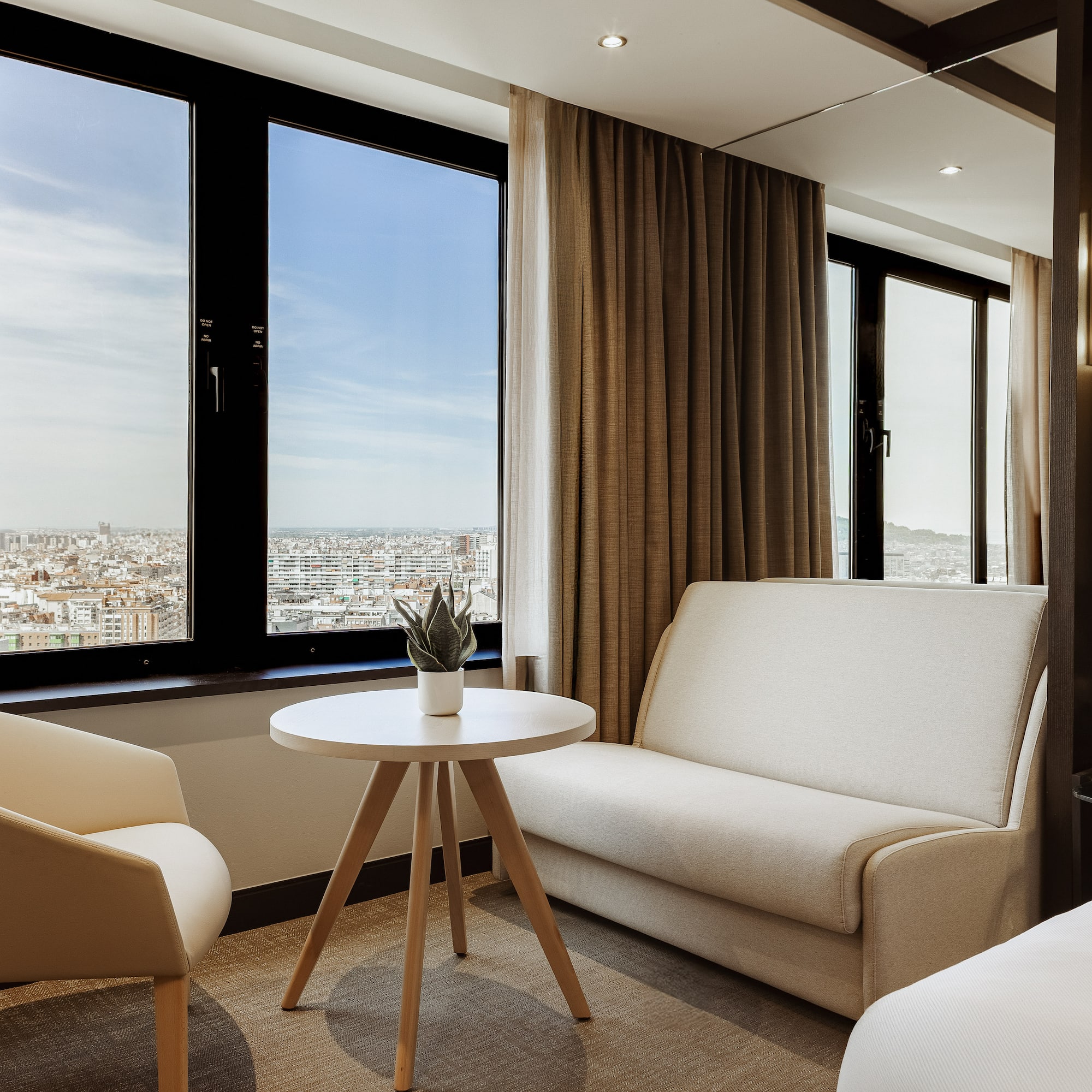 a room with two beds and a couch