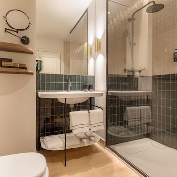 a bathroom with a shower and sink