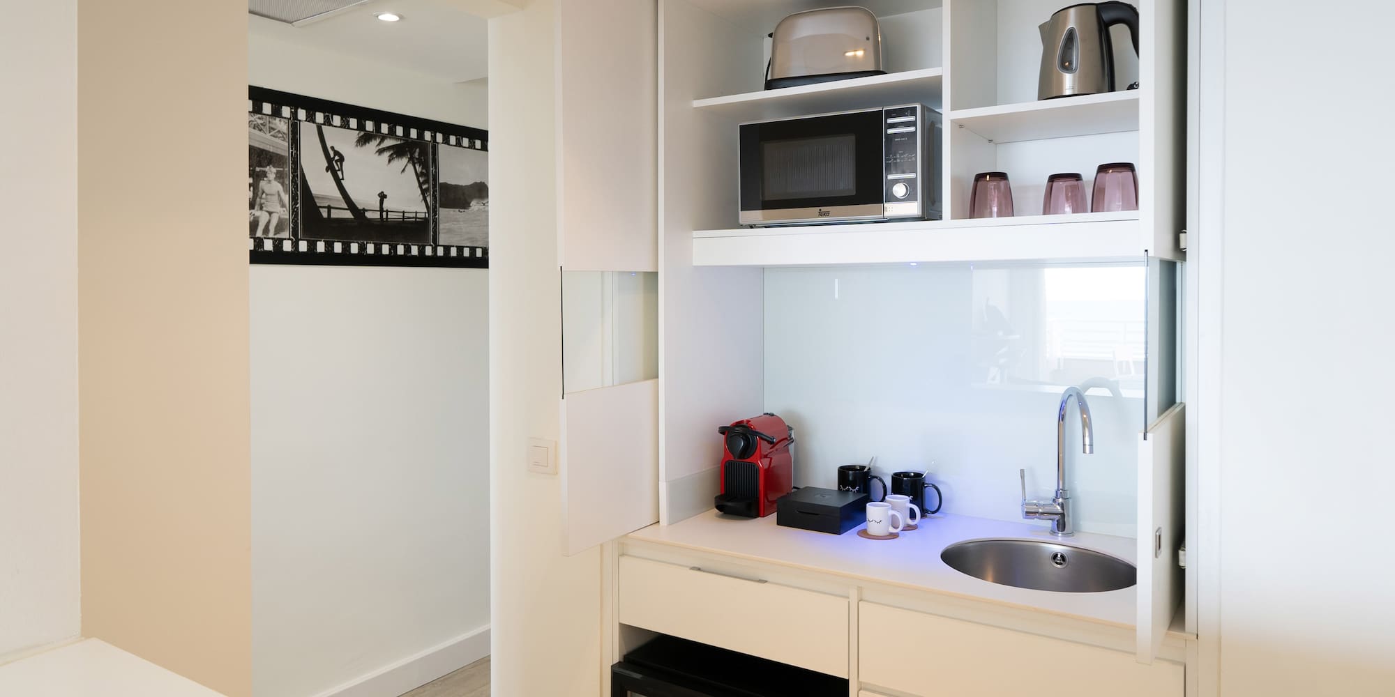 a kitchen with a sink and microwave