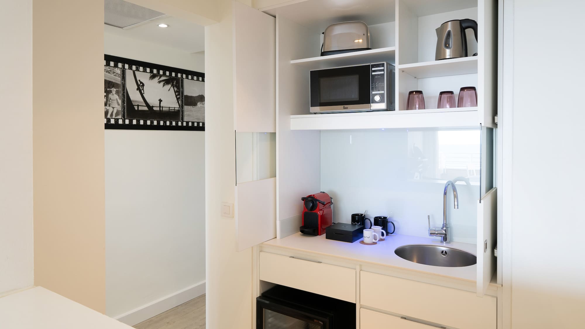 a kitchen with a sink and microwave