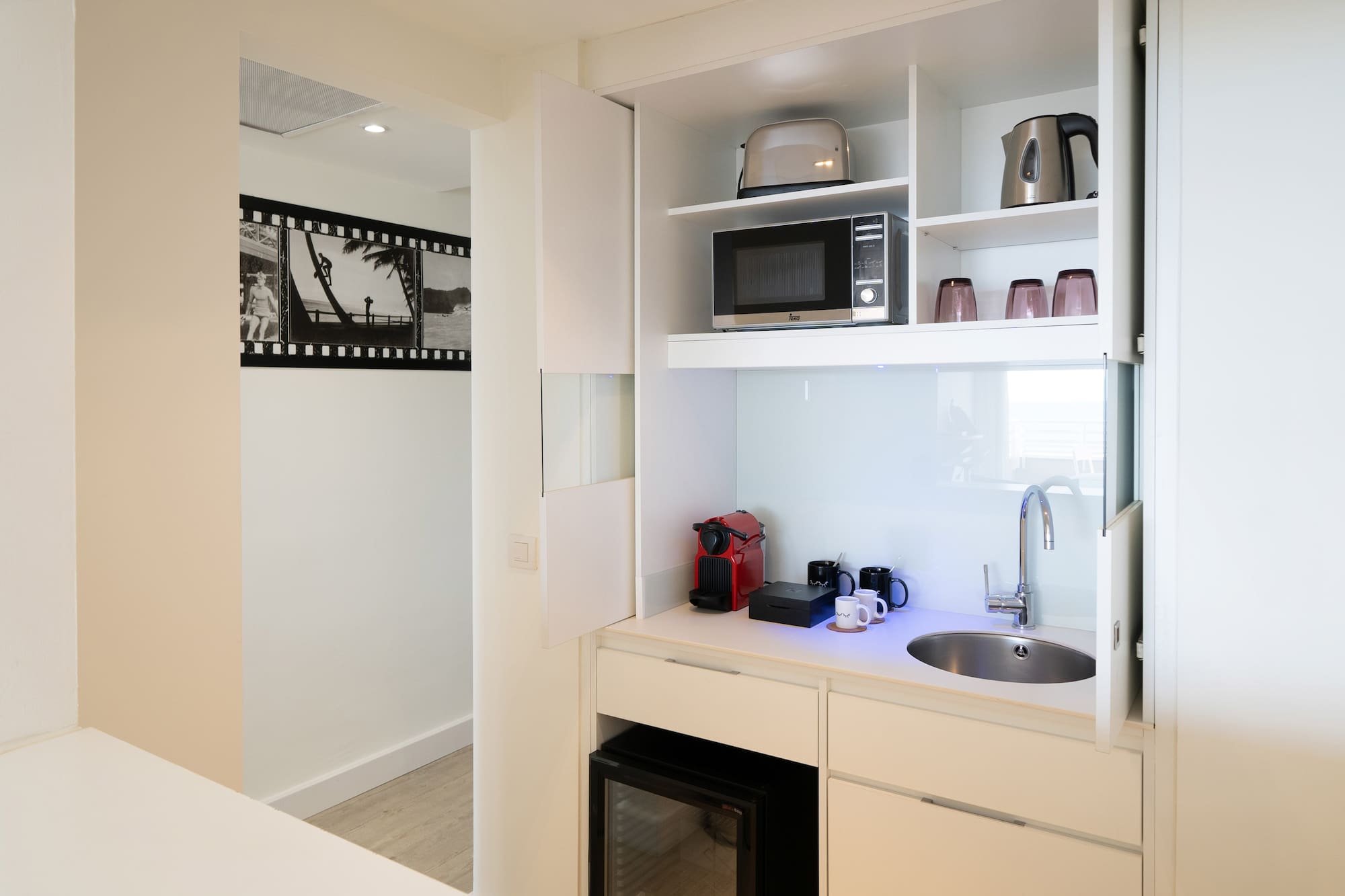 a kitchen with a sink and microwave