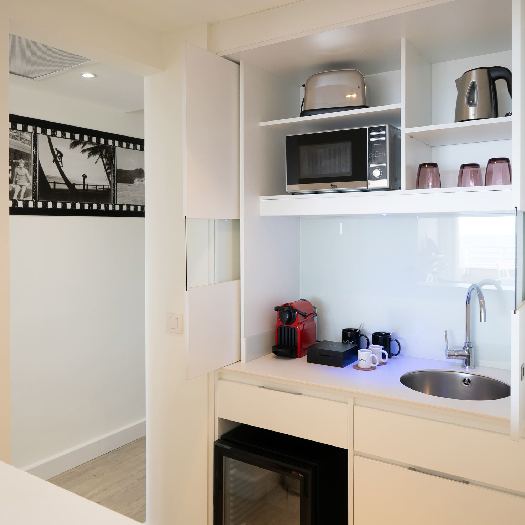 a kitchen with a sink and microwave