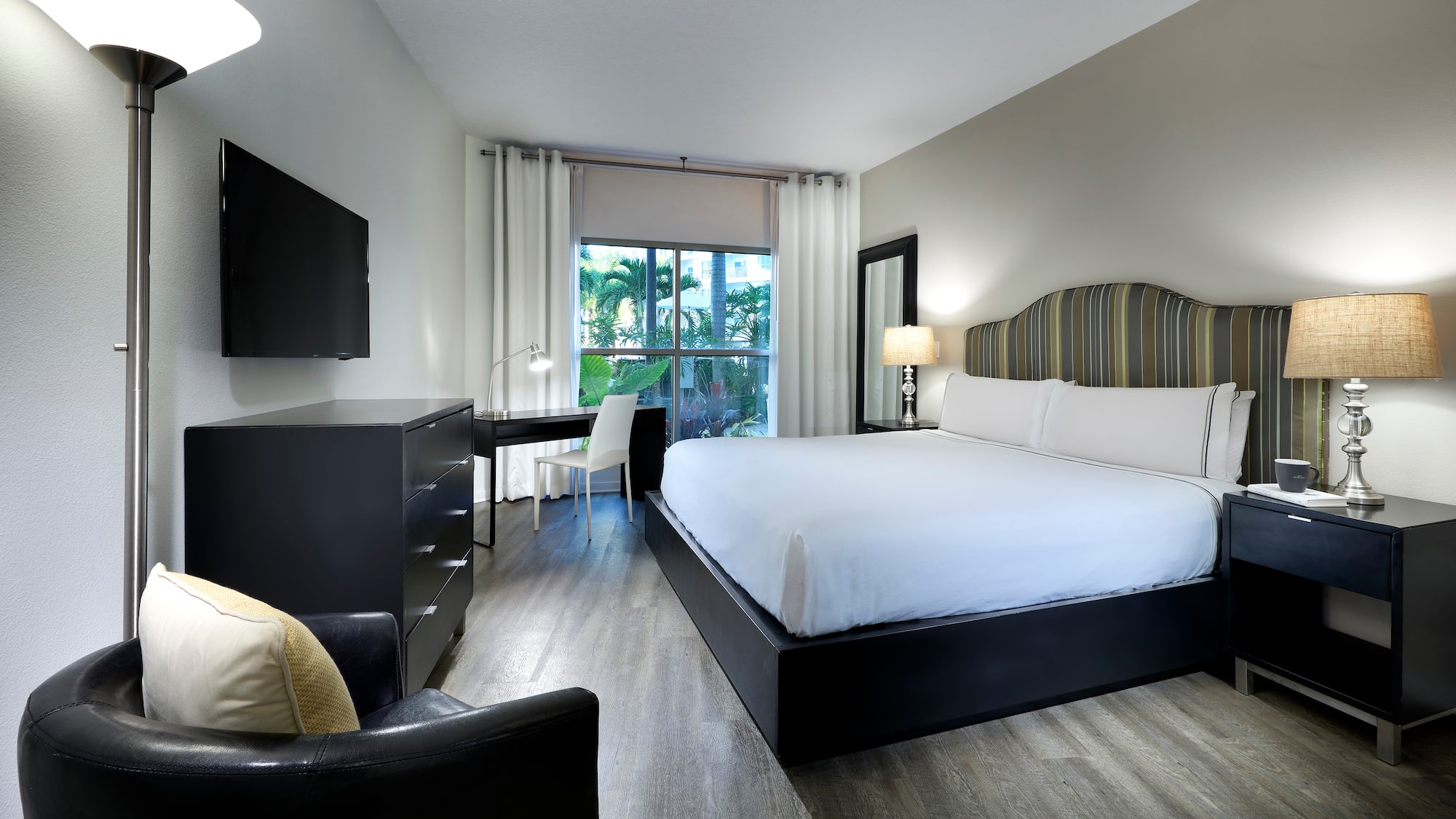 a bedroom with a bed and a desk