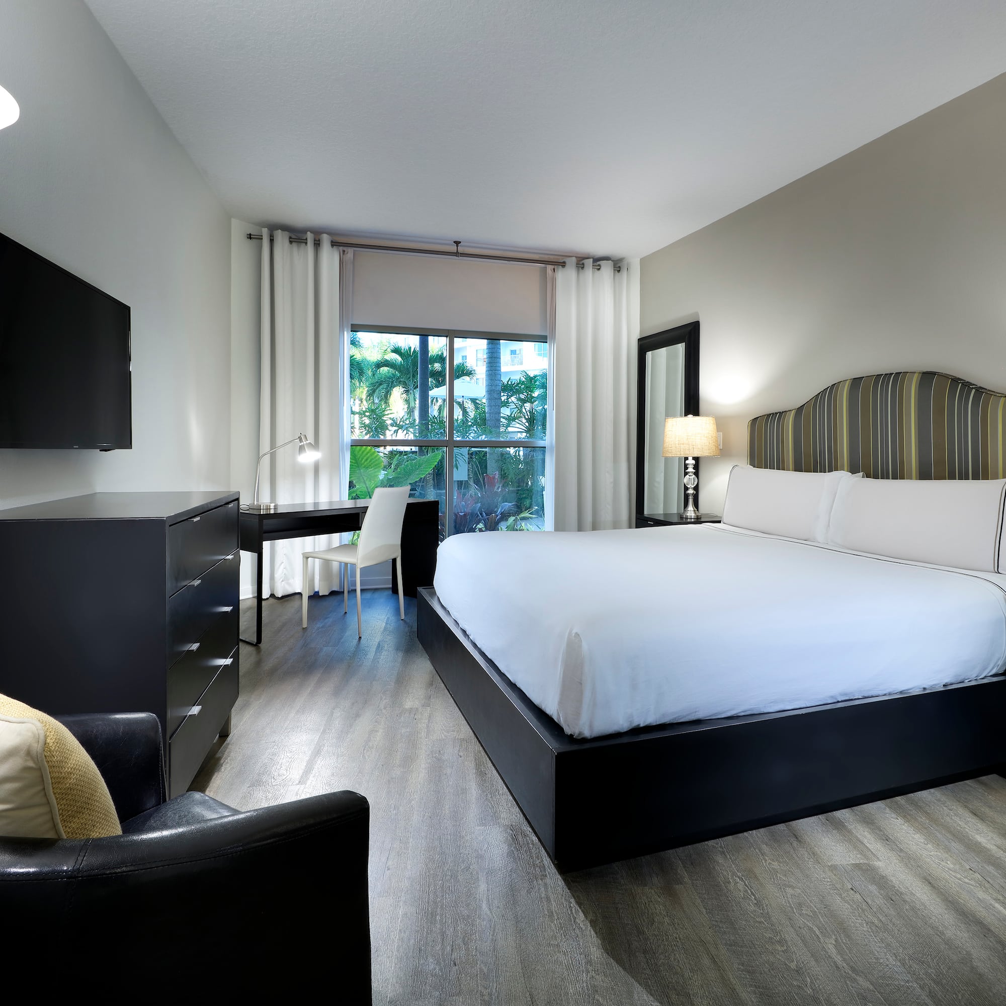 a bedroom with a bed and a desk