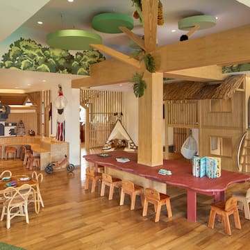 a room with a table and chairs