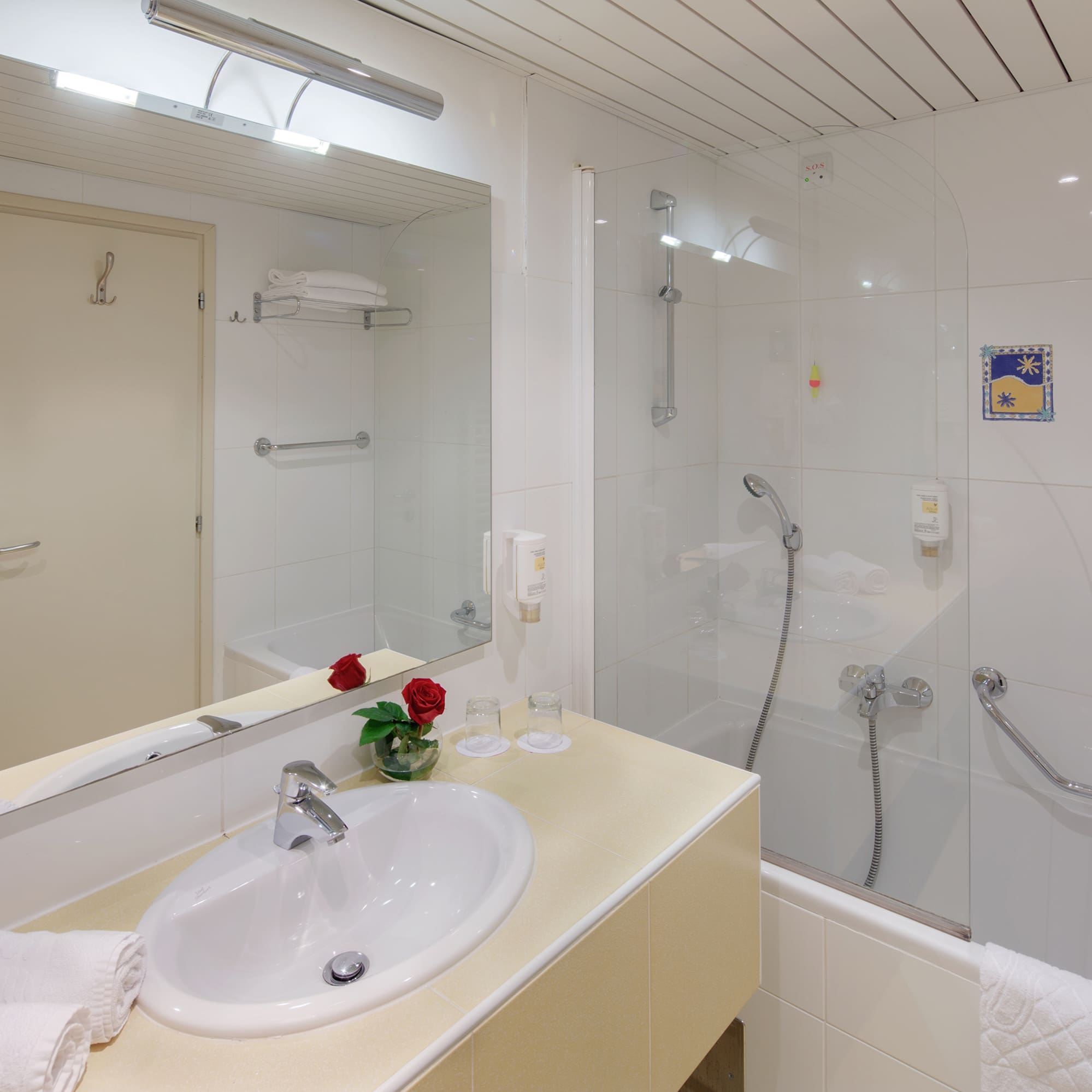 a bathroom with a shower and sink