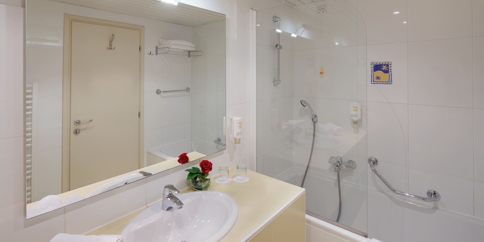 a bathroom with a shower and sink