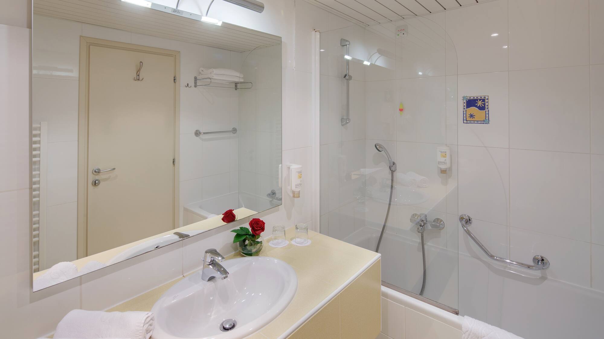 a bathroom with a shower and sink