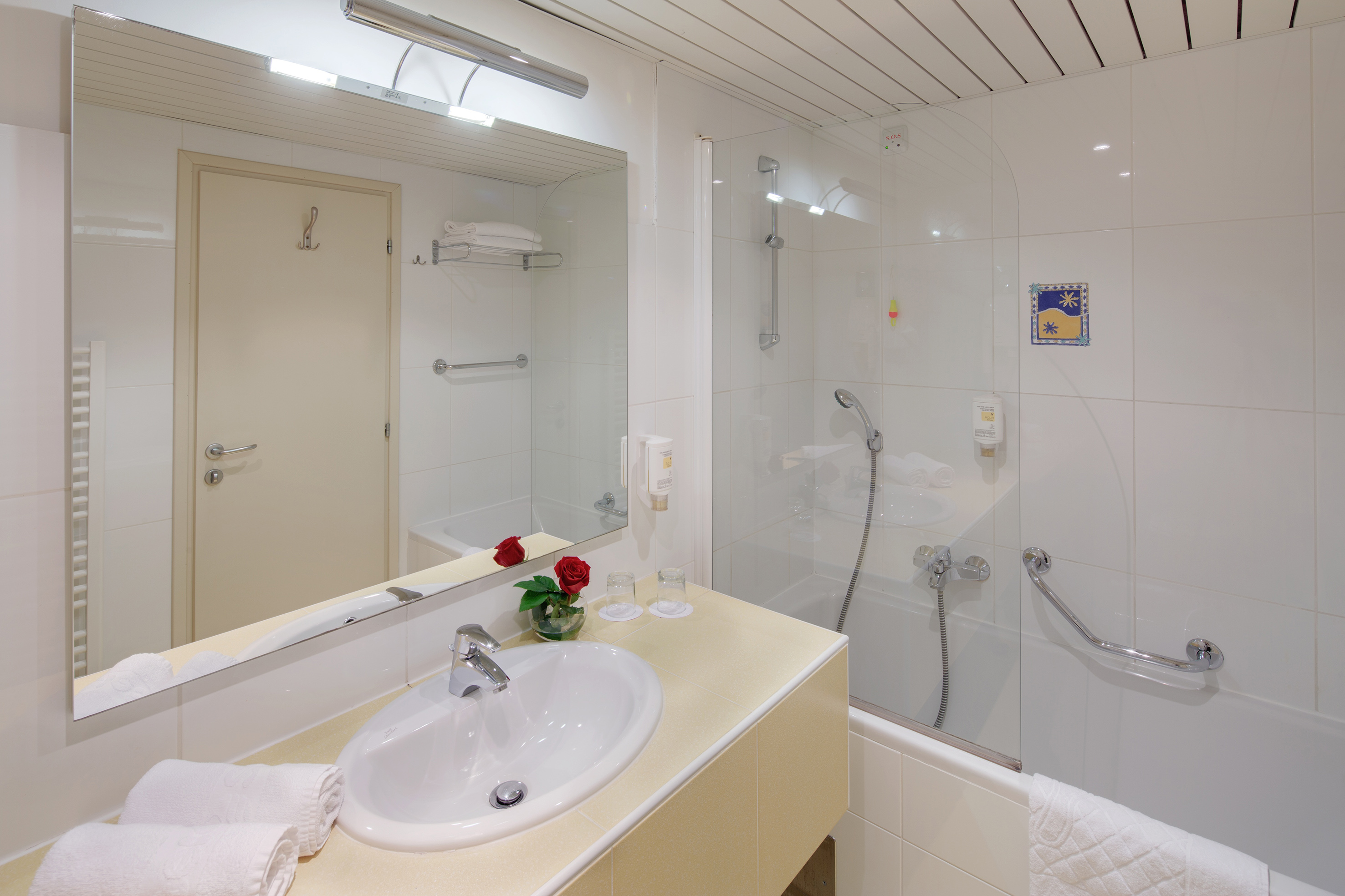 a bathroom with a shower and sink