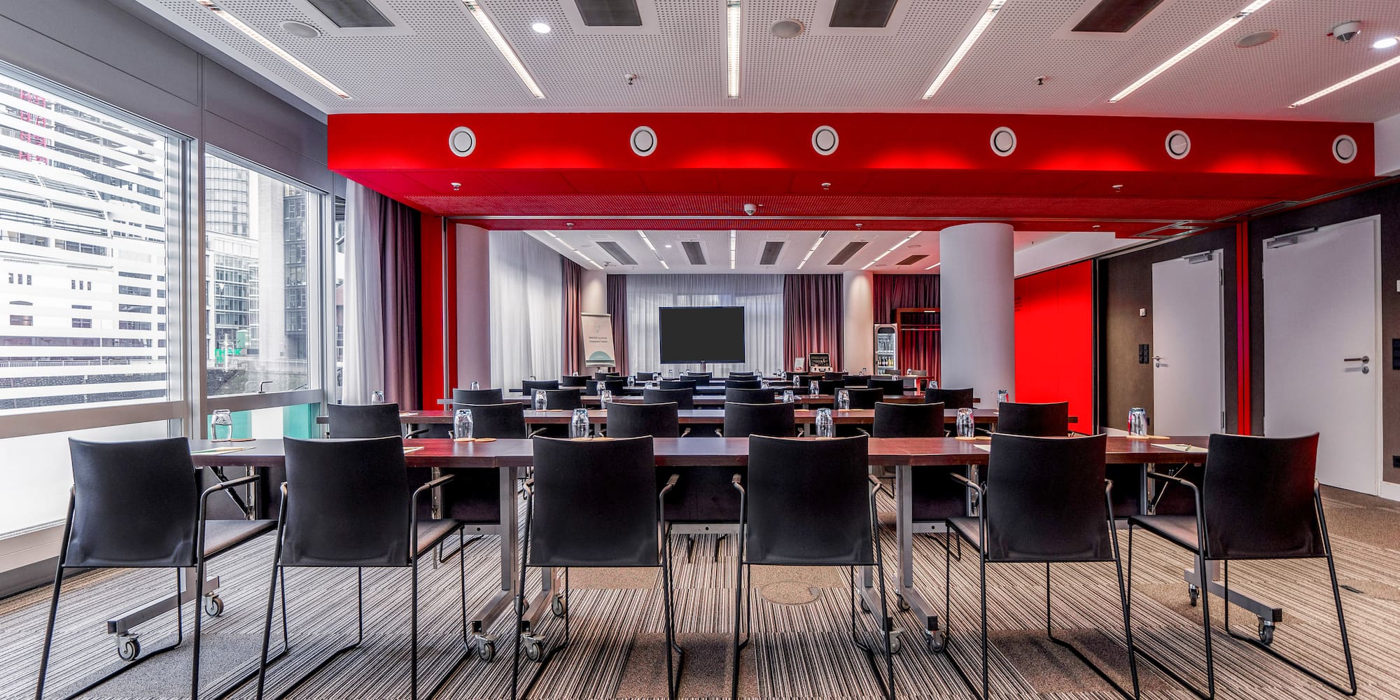 a room with a large table and chairs