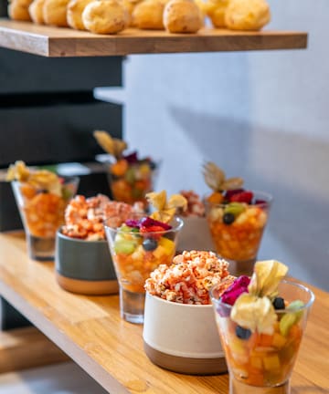 a group of glasses of fruit and popcorn