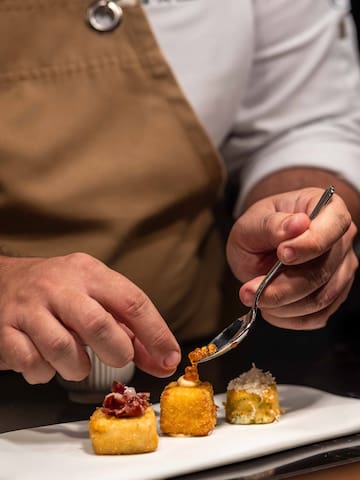 a person eating food with a fork