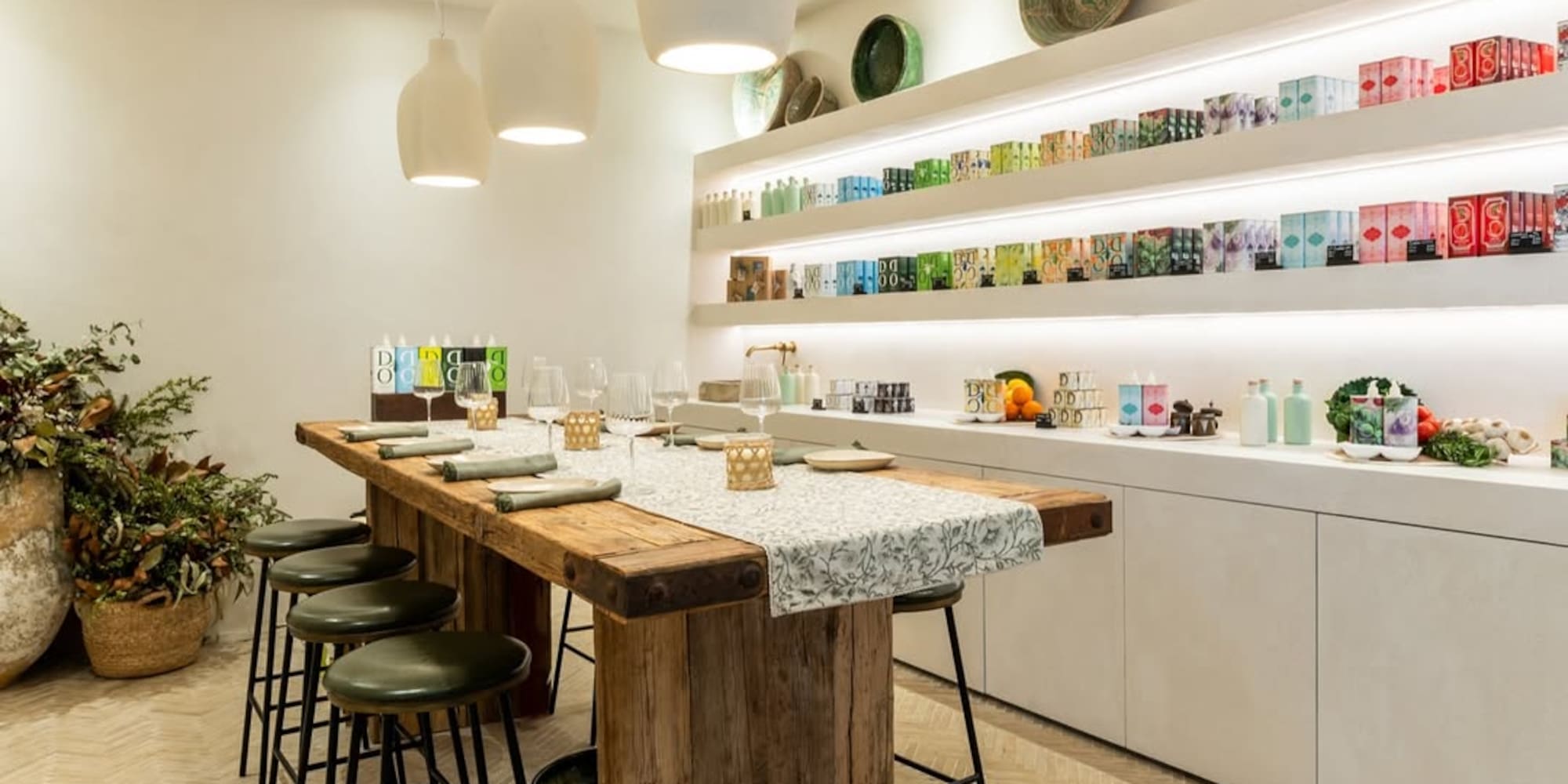 a table with stools and plates on shelves
