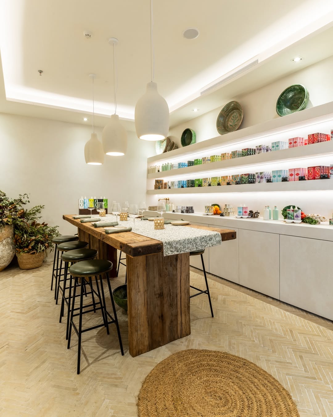 a table with stools and plates on shelves