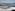 Piscina y tumbonas con vista a la marina de Palma y la Catedral de Mallorca.