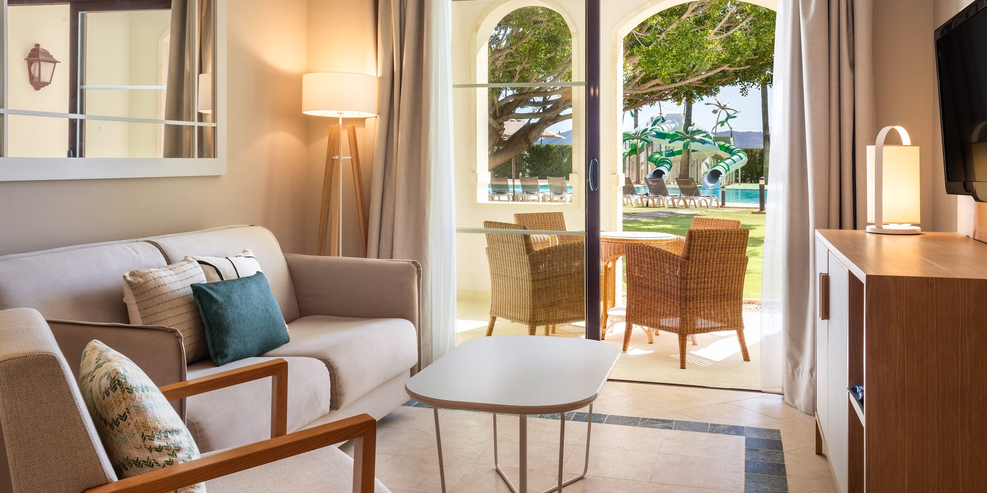 a living room with a couch and chairs