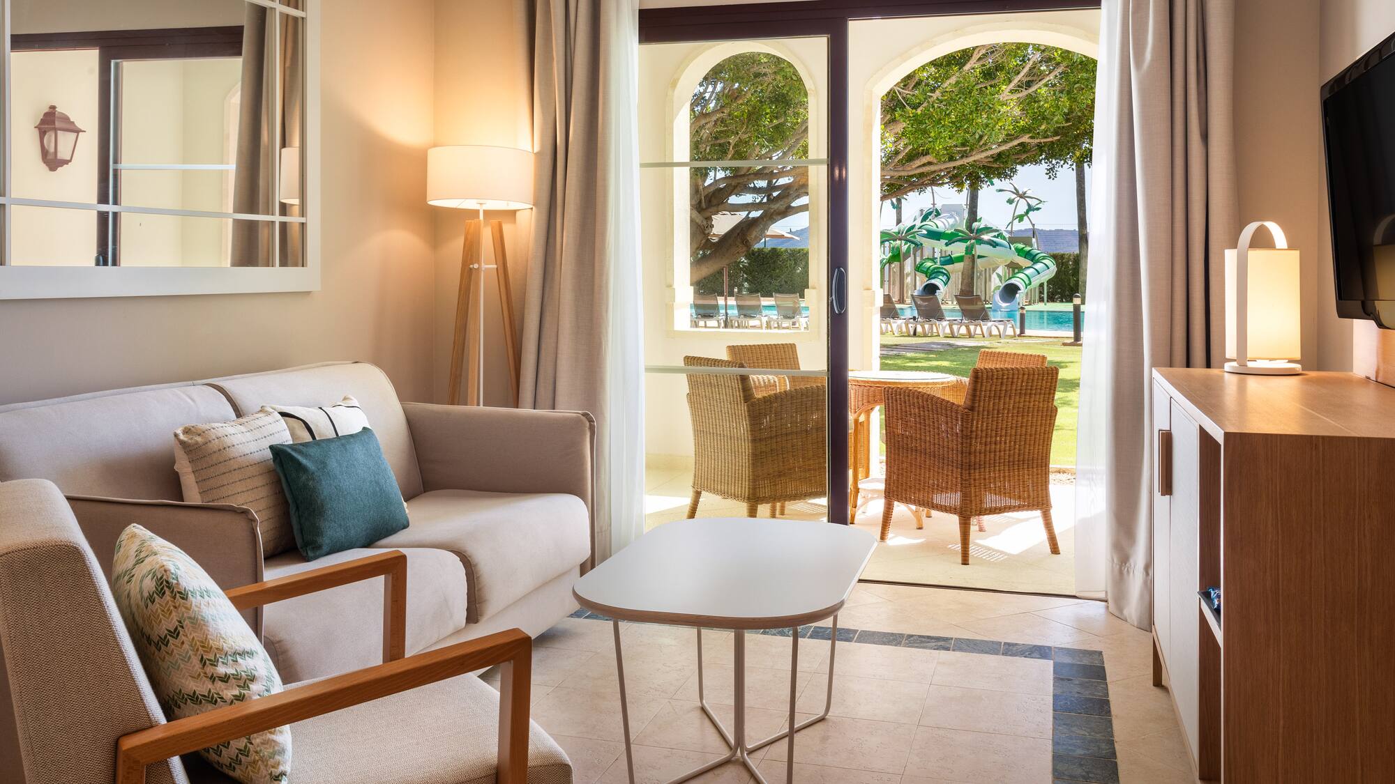 a living room with a couch and chairs