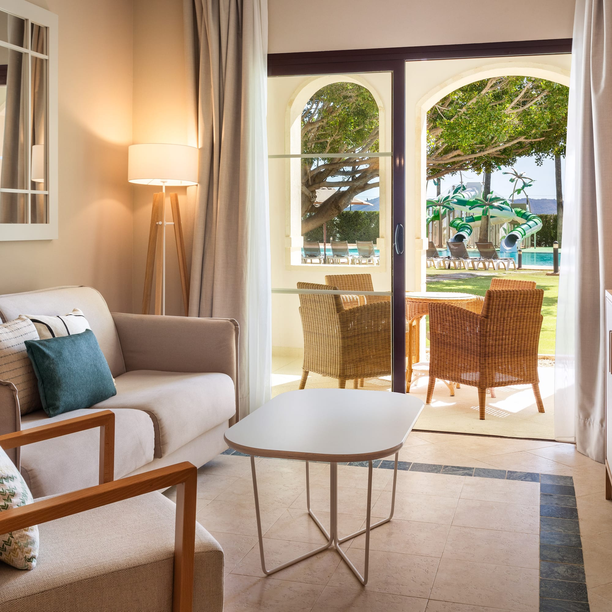 a living room with a couch and chairs