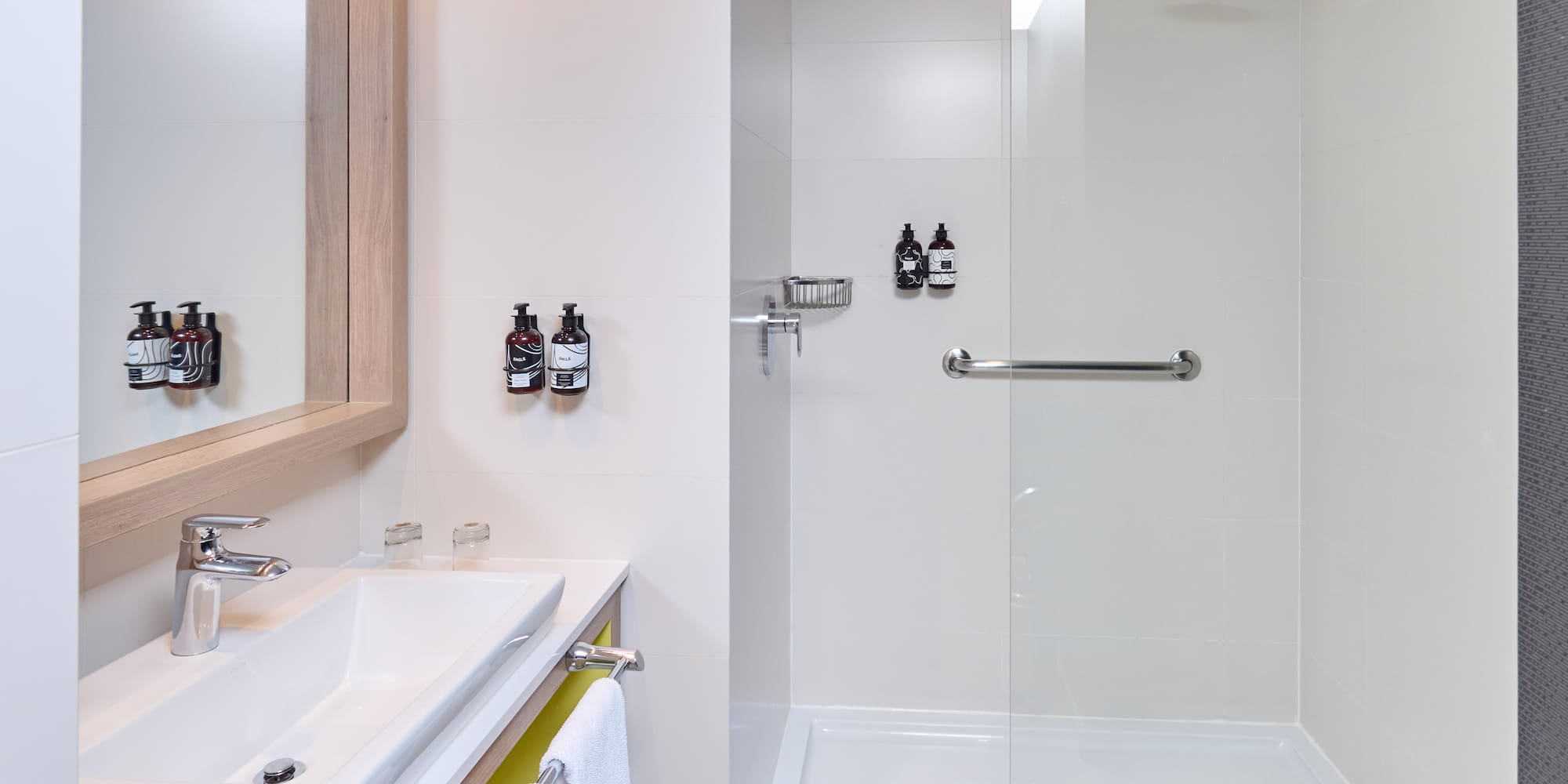 a bathroom with a shower and sink