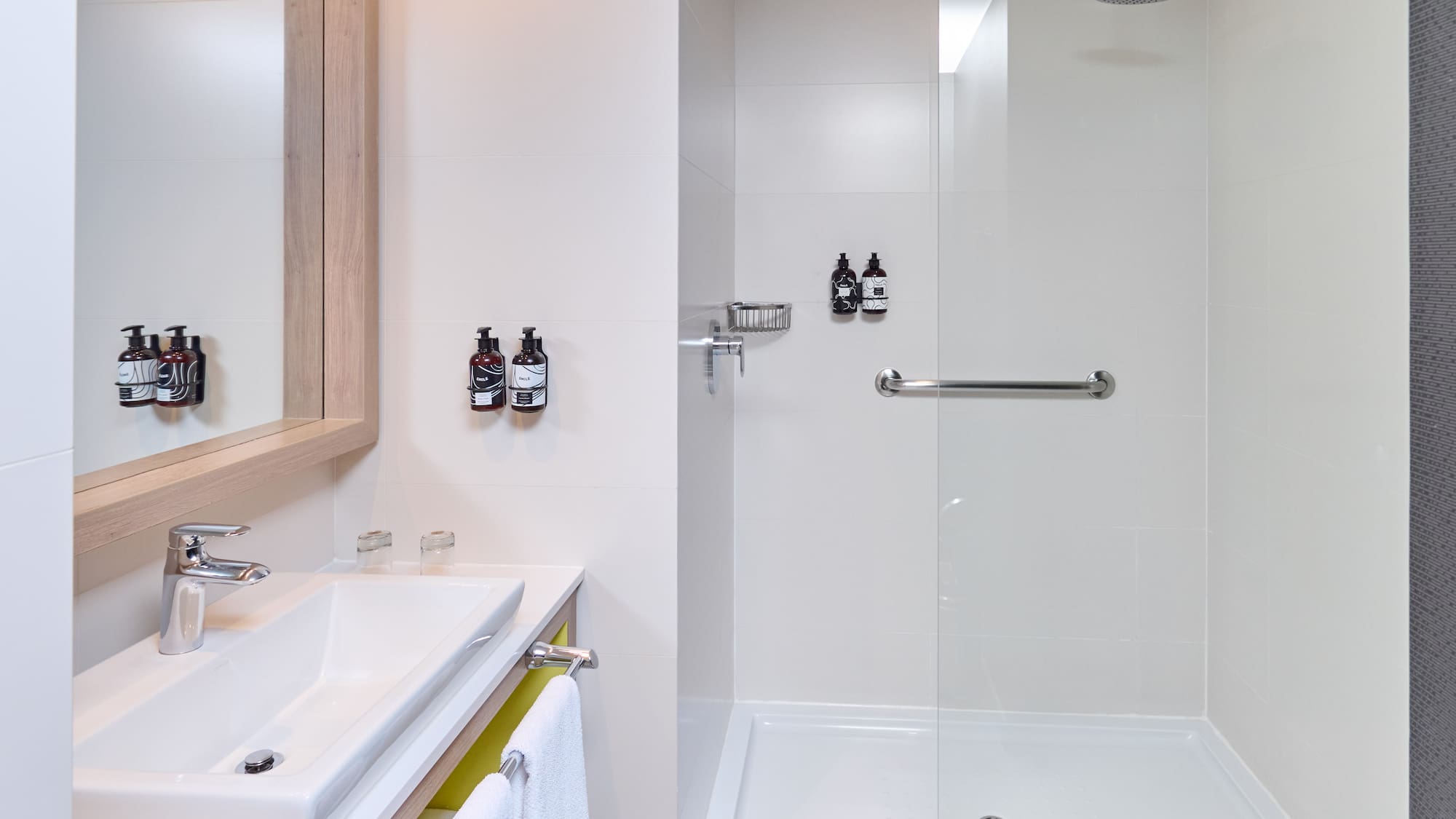 a bathroom with a shower and sink