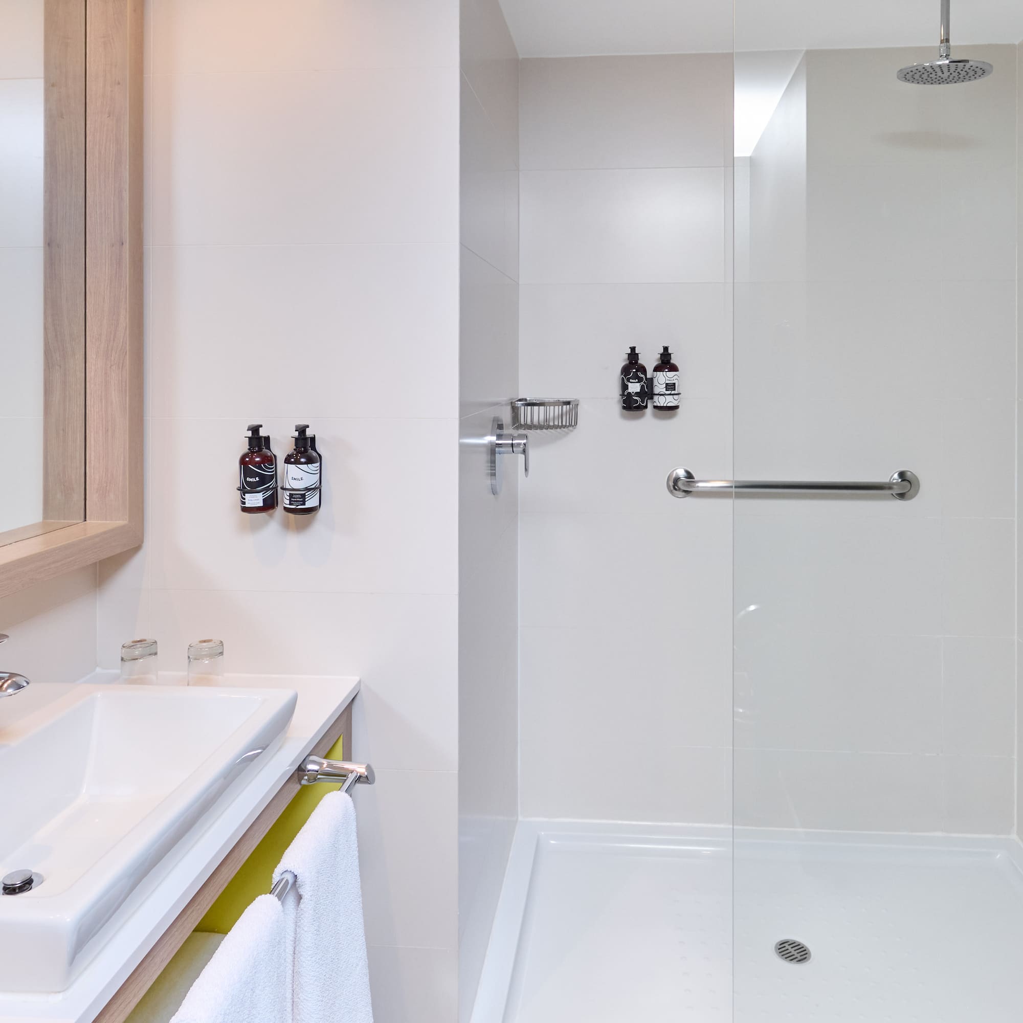 a bathroom with a shower and sink